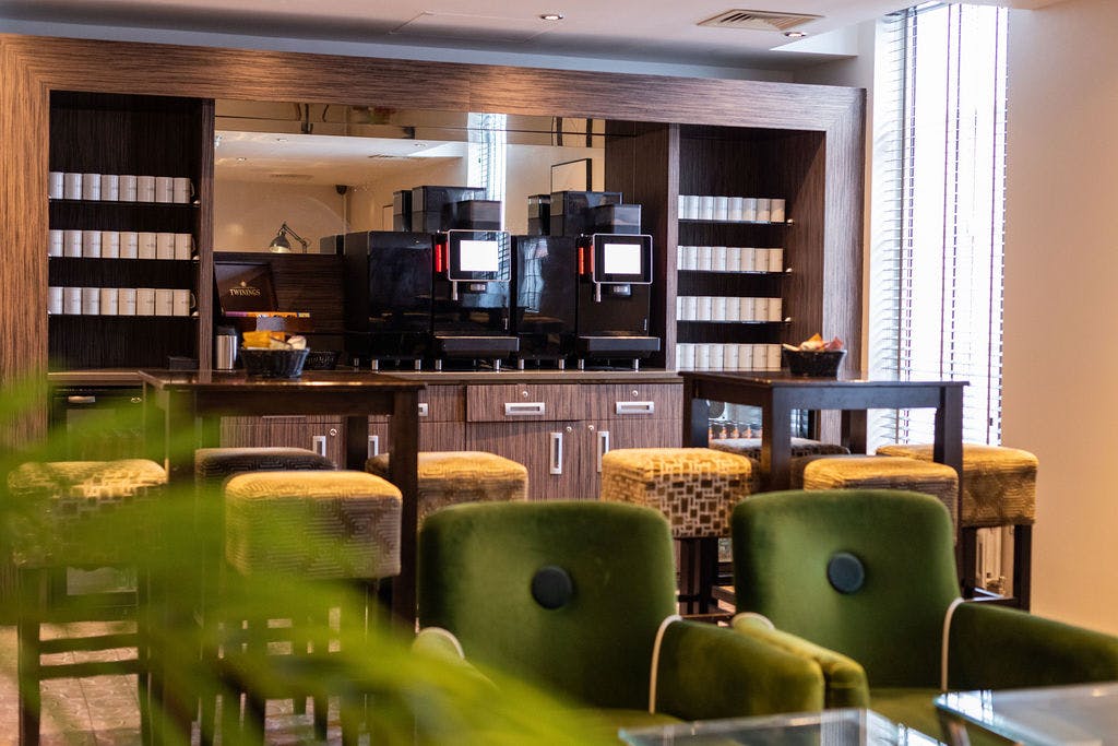 Modern coffee station in Mottram Hall's Conference Hub for networking events.