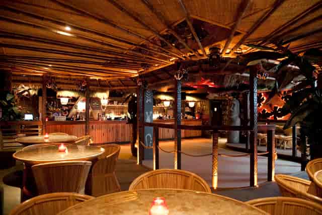 Vibrant tropical venue with bamboo decor for unique events and gatherings.