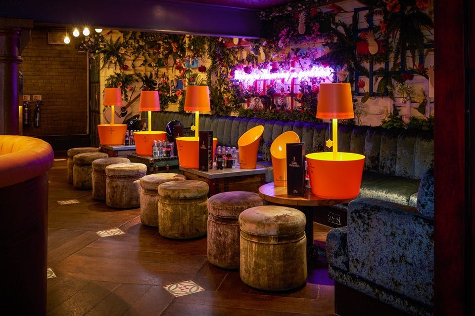 Vibrant Little Havana room at Embargo Republica, perfect for networking events and gatherings.
