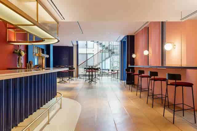 Elegant restaurant and bar venue with sleek design, perfect for social events and meetings.