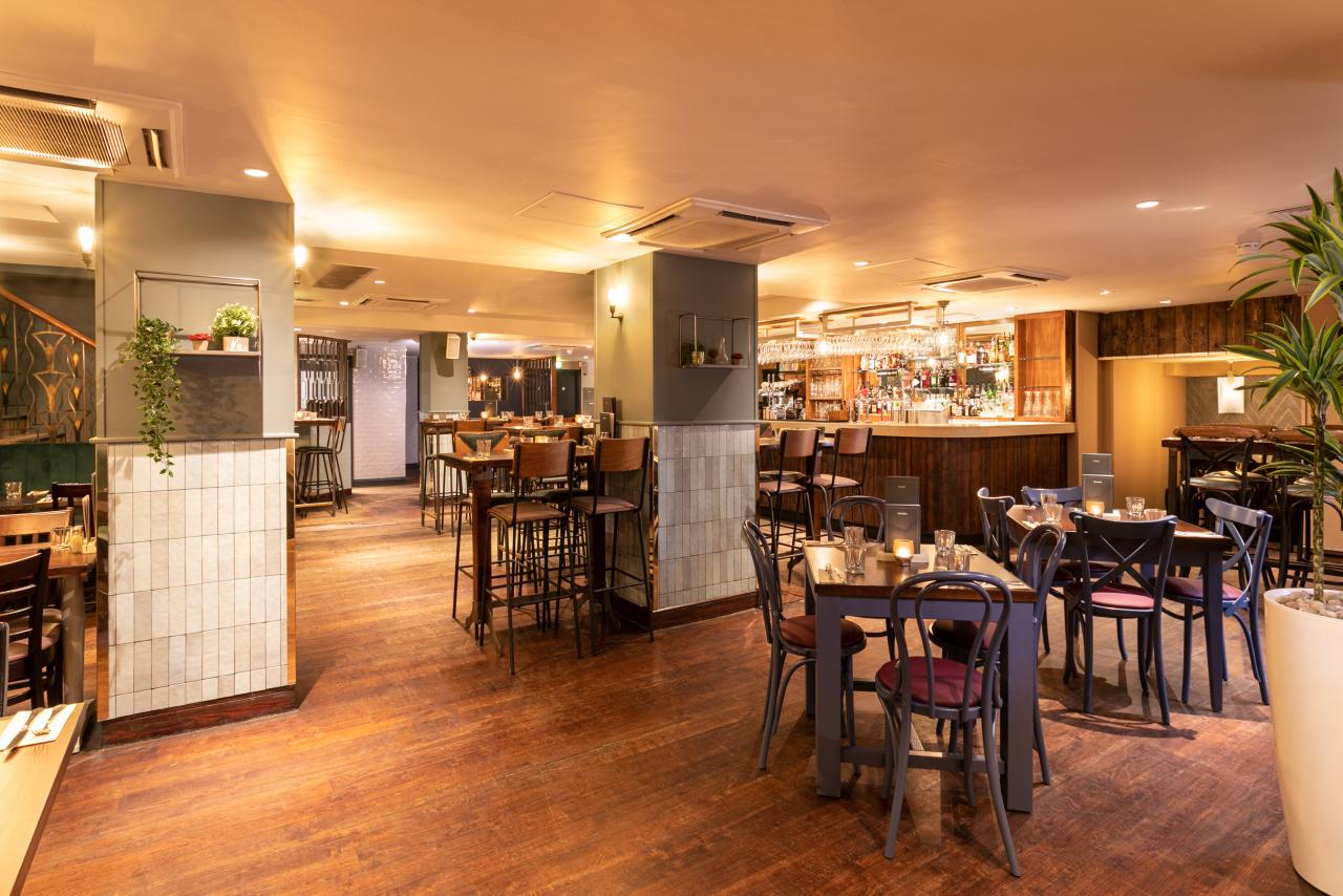 Basement Bar at Pitcher & Piano: warm lighting, ideal for events and meetings. - Banner
