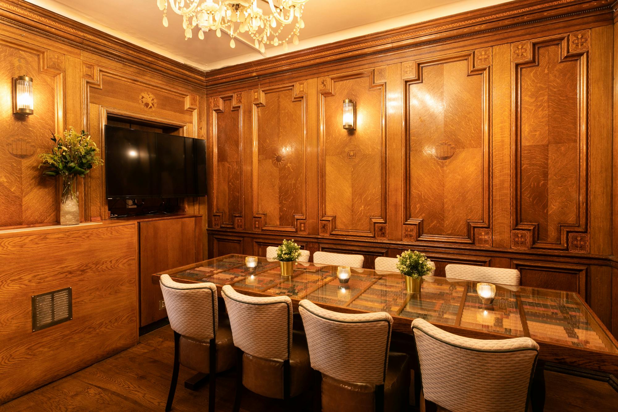 Sophisticated boardroom with wooden paneling for executive meetings and gatherings.