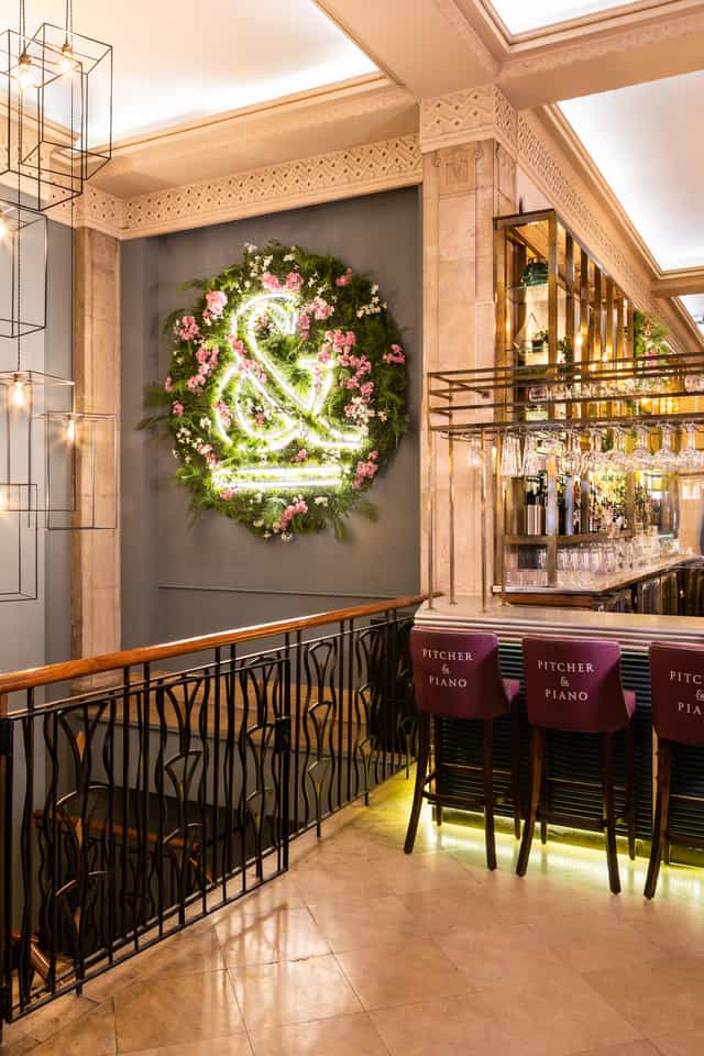 Stylish venue with floral backdrop, ideal for upscale events and gatherings.