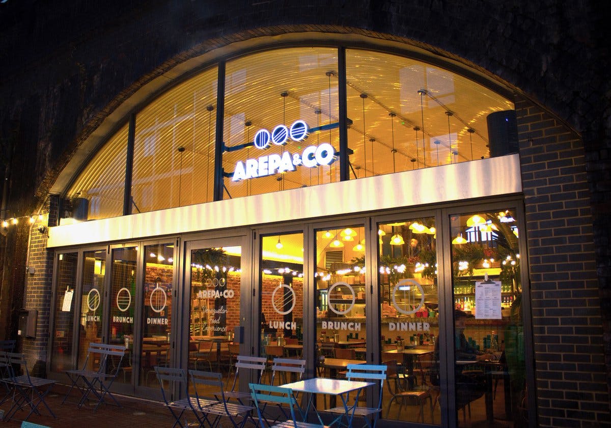 Vibrant Arepa & Co restaurant exterior, ideal for casual meetings and events.