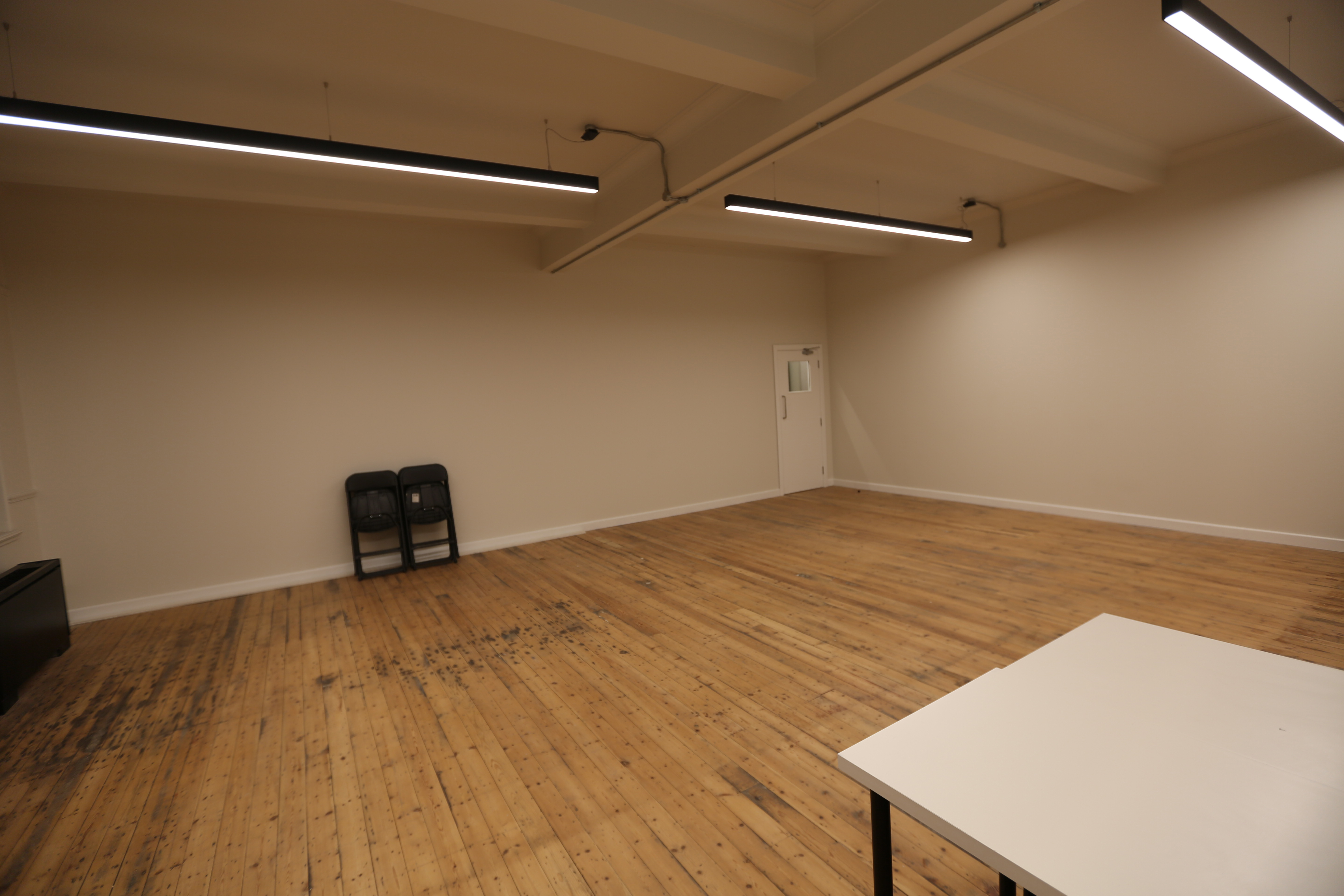 Spacious minimalist meeting room in The International College of Musical Theatre for workshops.