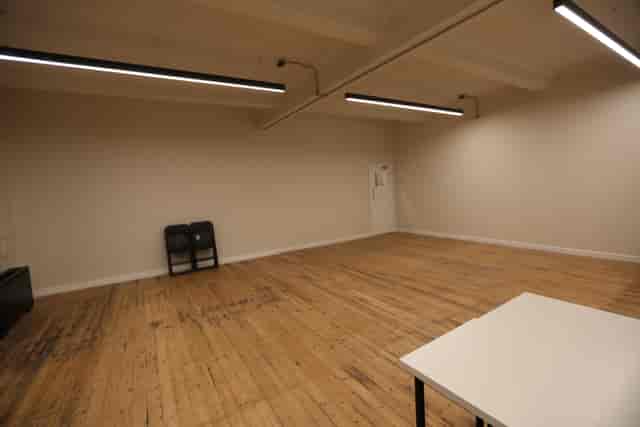 Spacious minimalist meeting room in The International College of Musical Theatre for workshops.