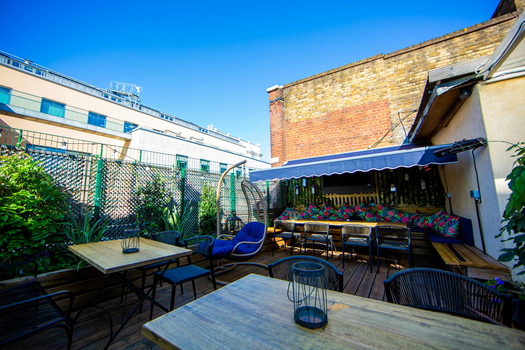 Vibrant outdoor event space at Bow Street Tavern with greenery and seating for gatherings.