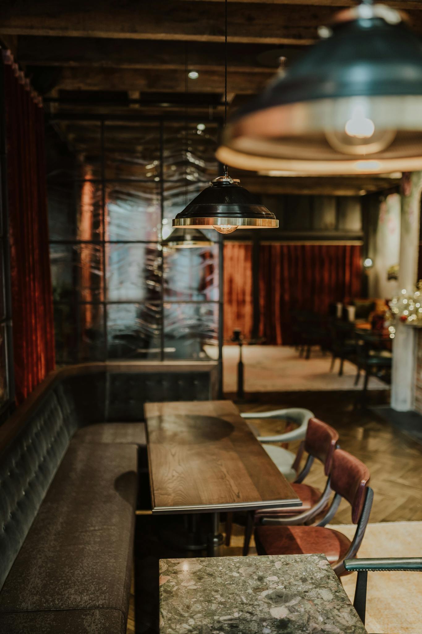 Stylish event space in The Gun London with warm lighting, ideal for gatherings and meetings.