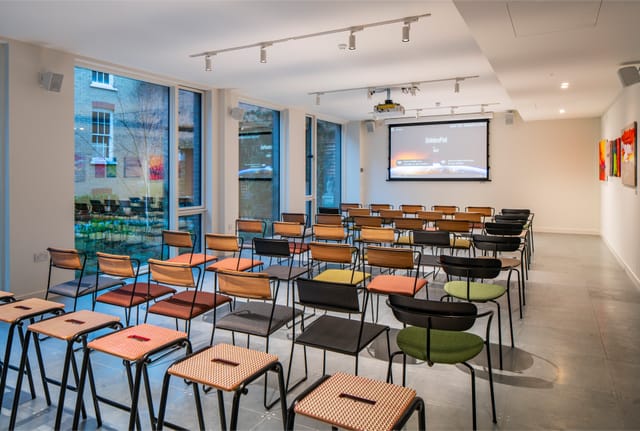 Versatile meeting space in People's Mission Hall for corporate events and workshops.