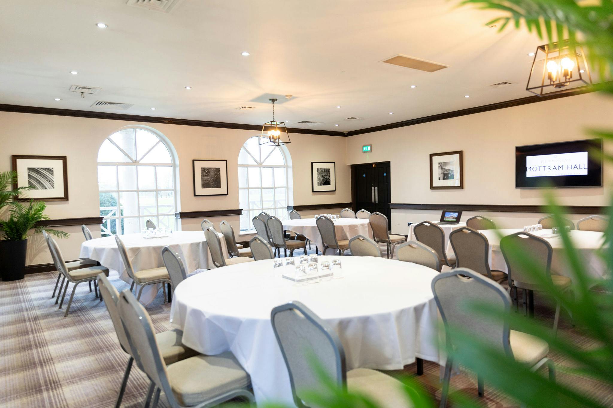 Thomas Suite at Mottram Hall: elegant meeting room for conferences with natural light.