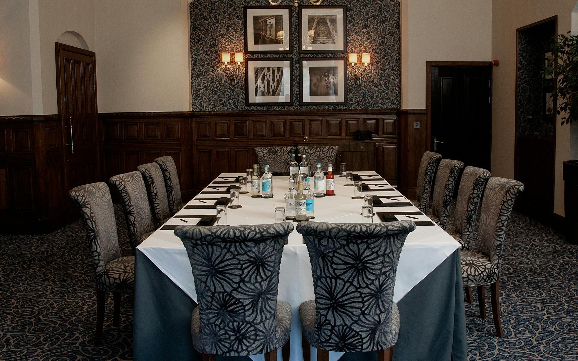 Corporate meeting room at Rockliffe Hall with elegant table settings and ambient lighting.