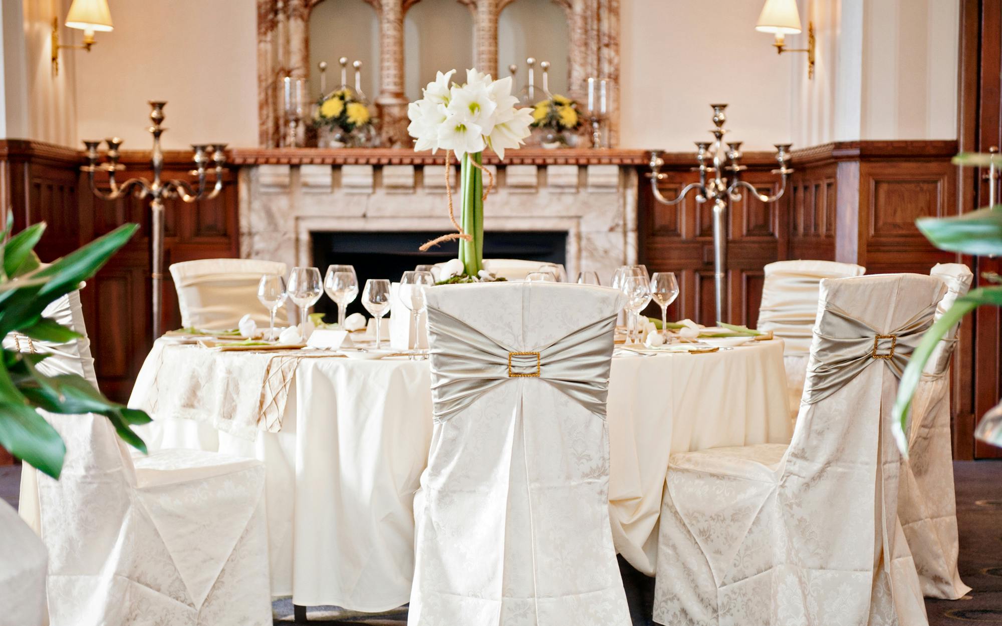 Elegant dining table with floral centerpieces at Rockliffe Hall for weddings and galas.