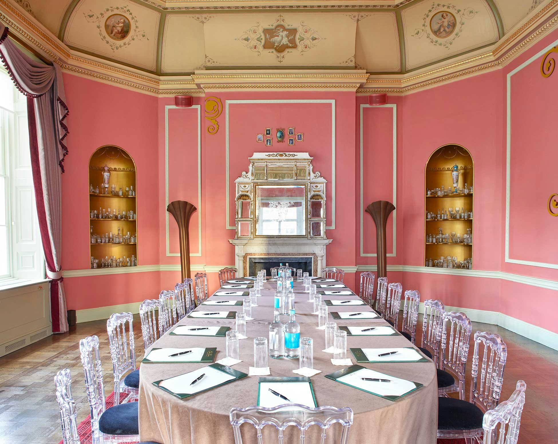 Elegant Octagon Dining Room with modern chairs, perfect for corporate events and meetings.