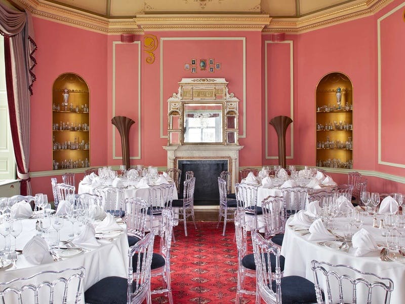 Elegant Octagon Dining Room with round tables, ideal for upscale events and formal dinners.