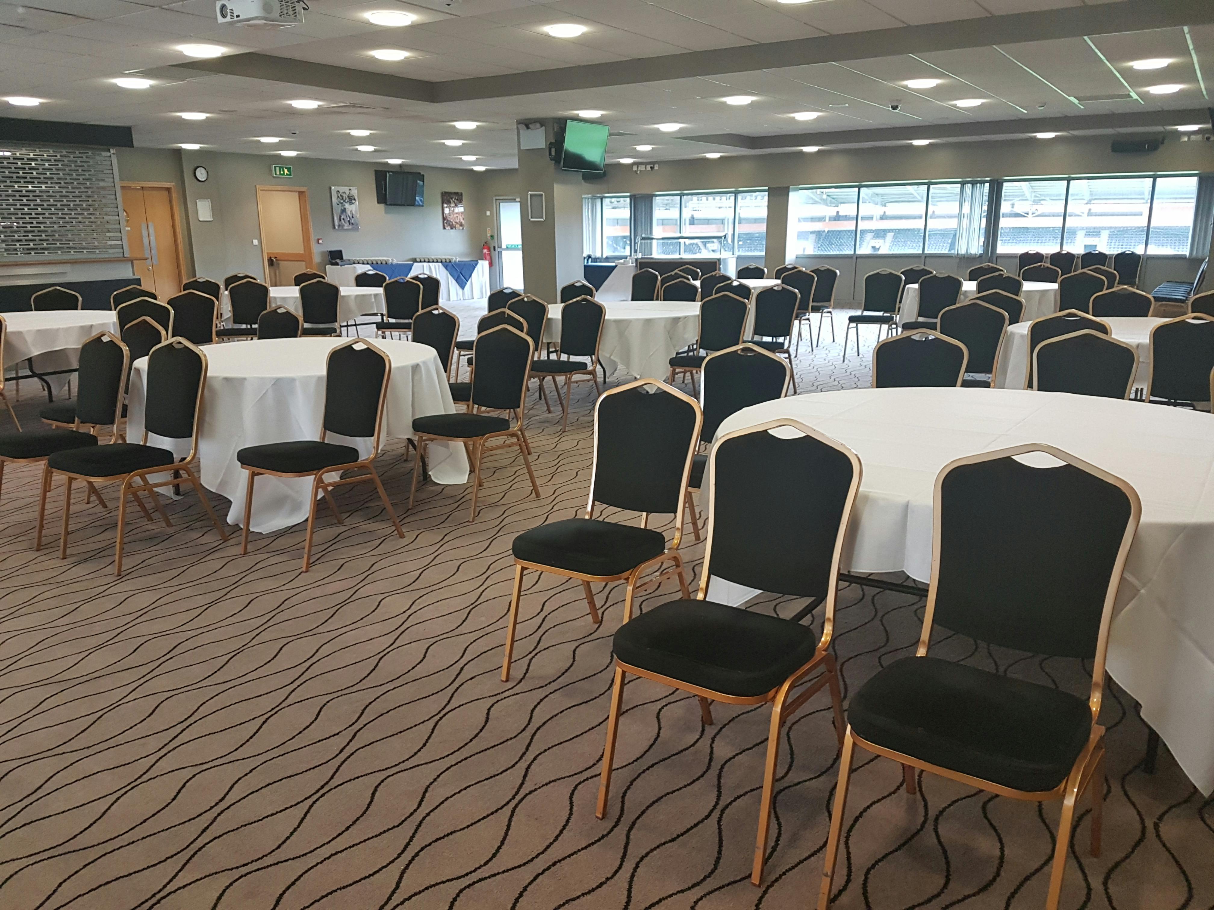 Circle Restaurant in MKM Stadium, featuring round tables for meetings and banquets.