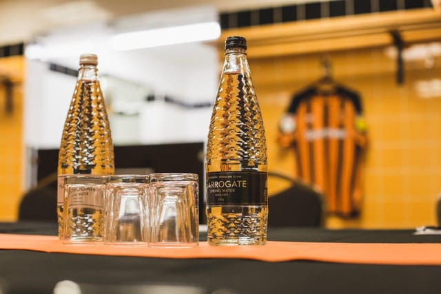 MKM Stadium meeting setup with bottled water, ideal for corporate events and team-building.