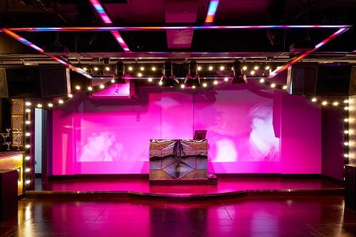 Vibrant Le Club event space with dynamic lighting, ideal for nightlife and parties.