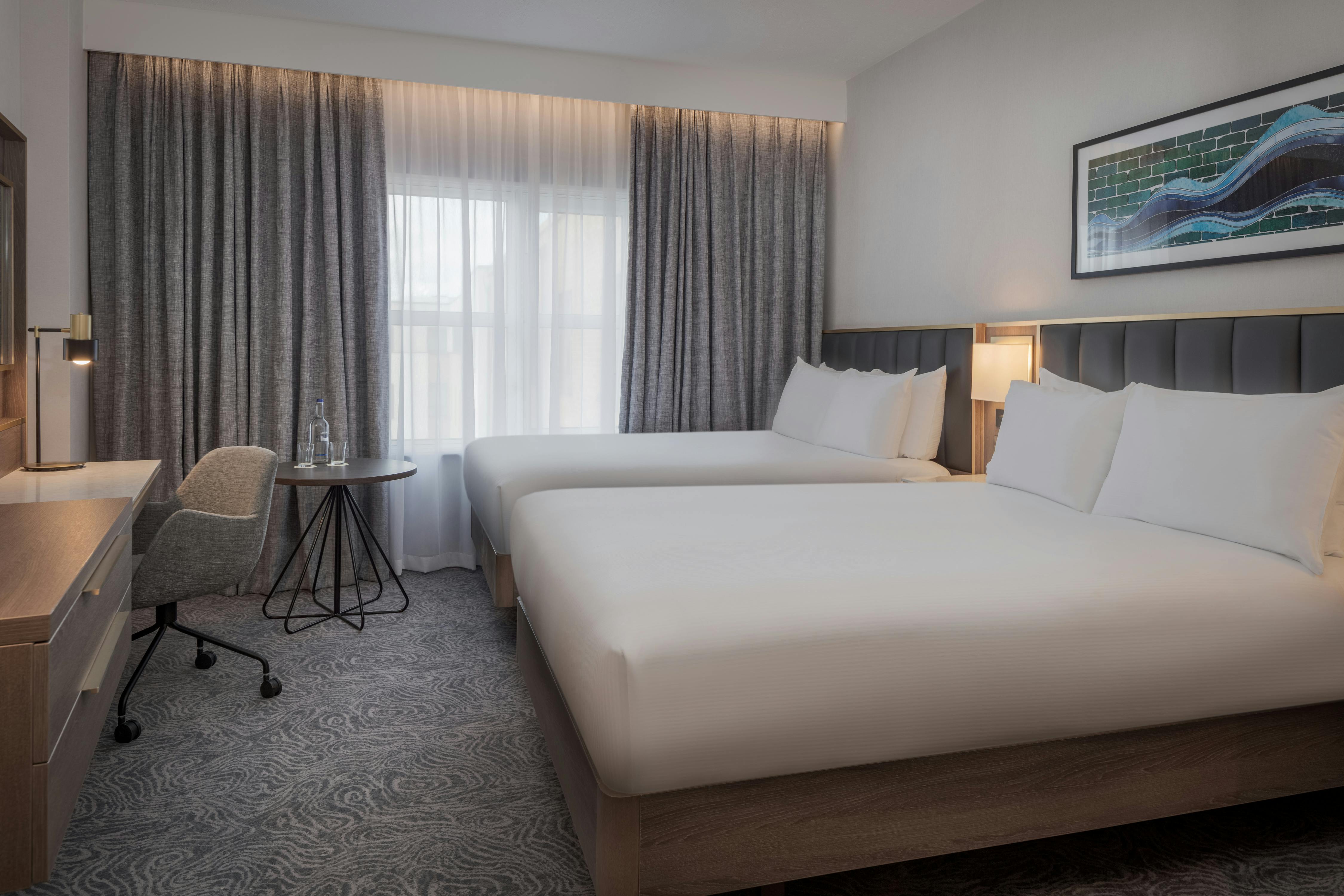 Kings Cross Suite with two beds, ideal for business events and relaxation in London.