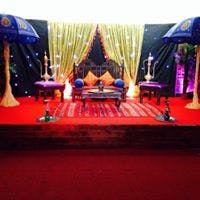 Vibrant Praba Banqueting Suite stage setup for weddings and cultural events.