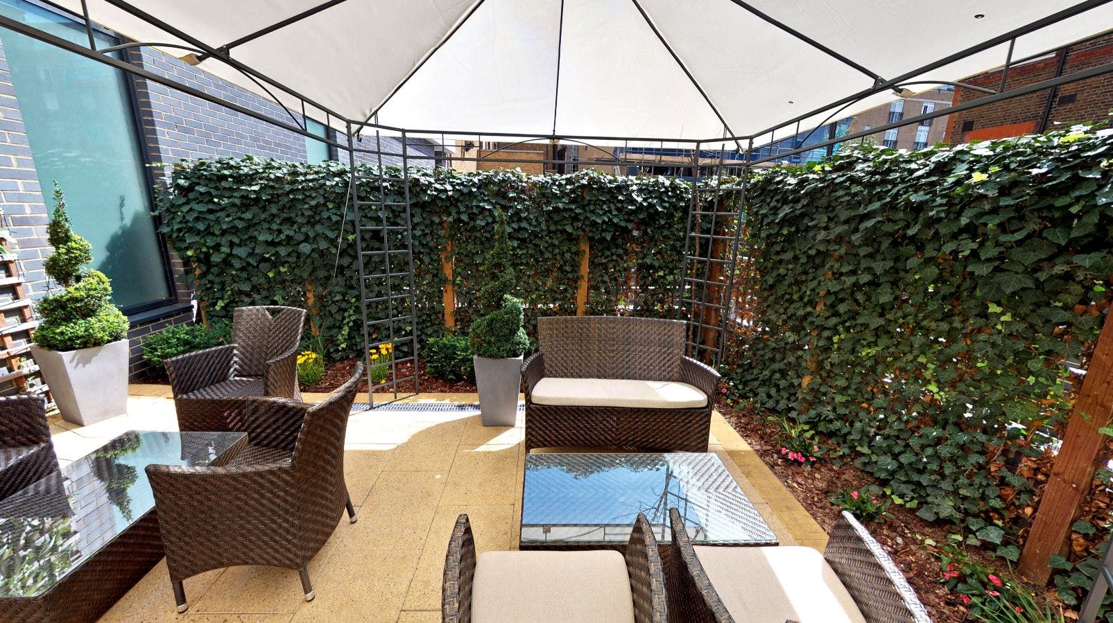 Stylish outdoor lounge at DoubleTree London, perfect for networking events and meetings.