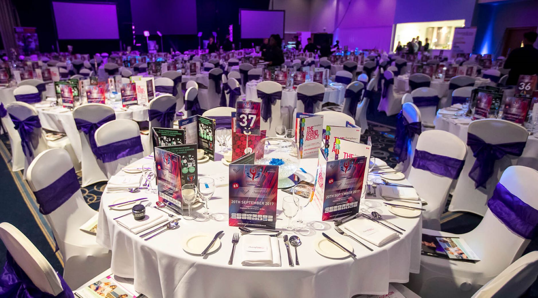 Banqueting Suite gala setup at Edgbaston Stadium with purple accents for corporate awards dinners.