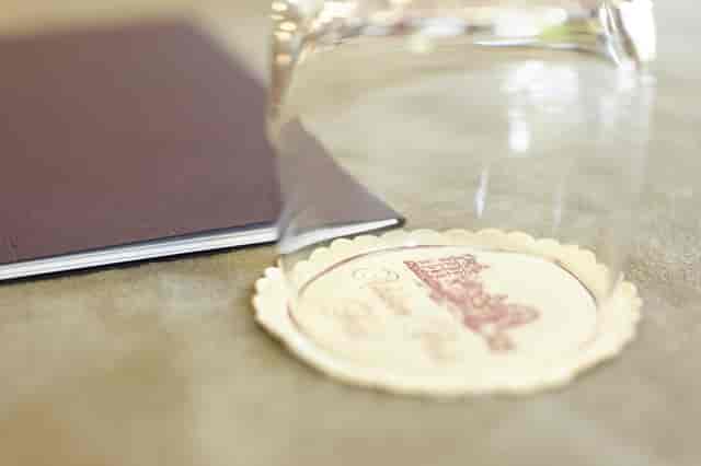 Edward Petre at Ashdown Park Hotel, elegant event setup with glass and notebook.