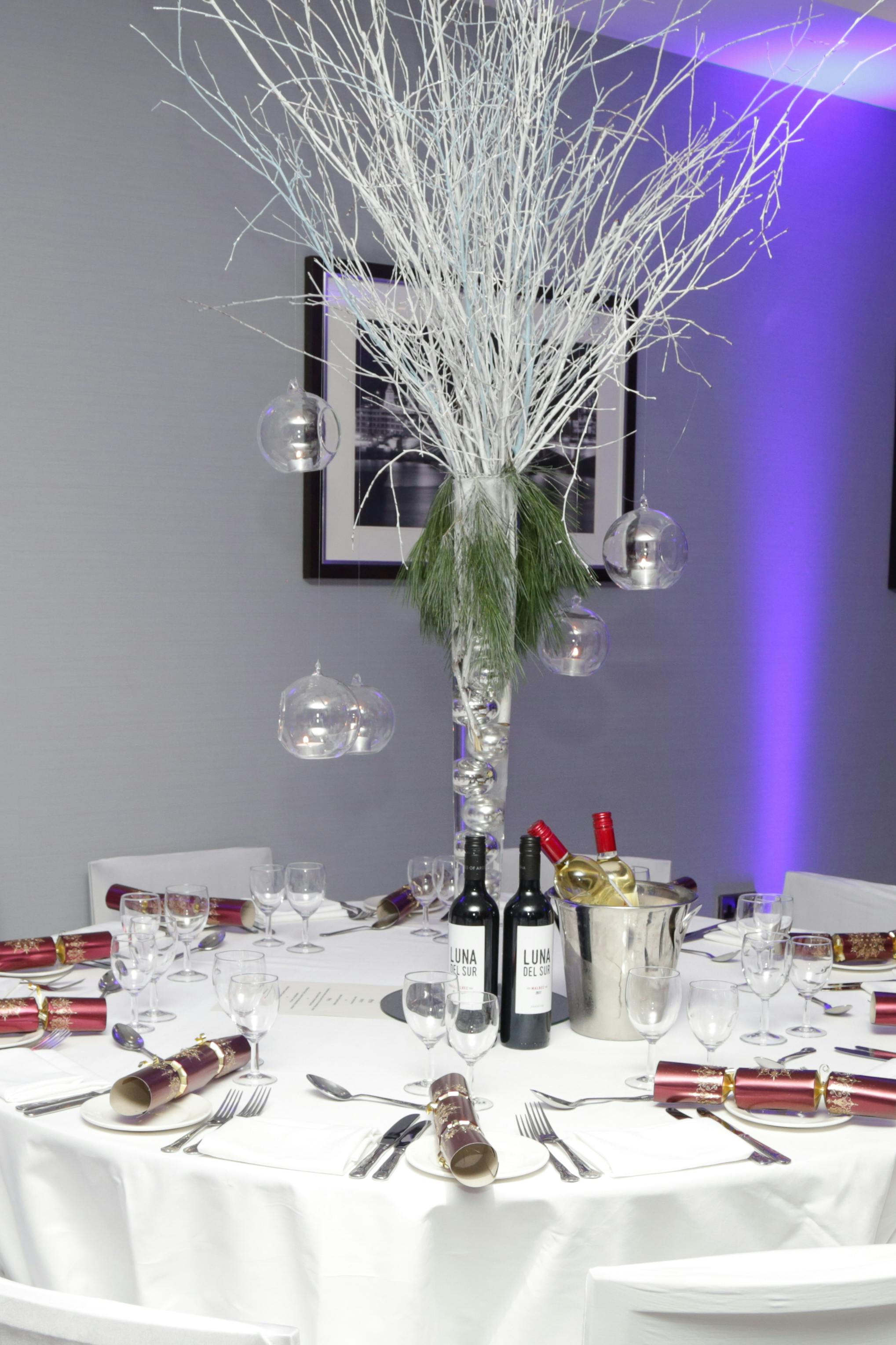 Elegant event table with glass orbs centerpiece at DoubleTree London for upscale gatherings.