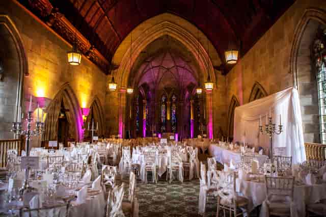 Elegant banquet hall with round tables, ideal for weddings and gala dinners.