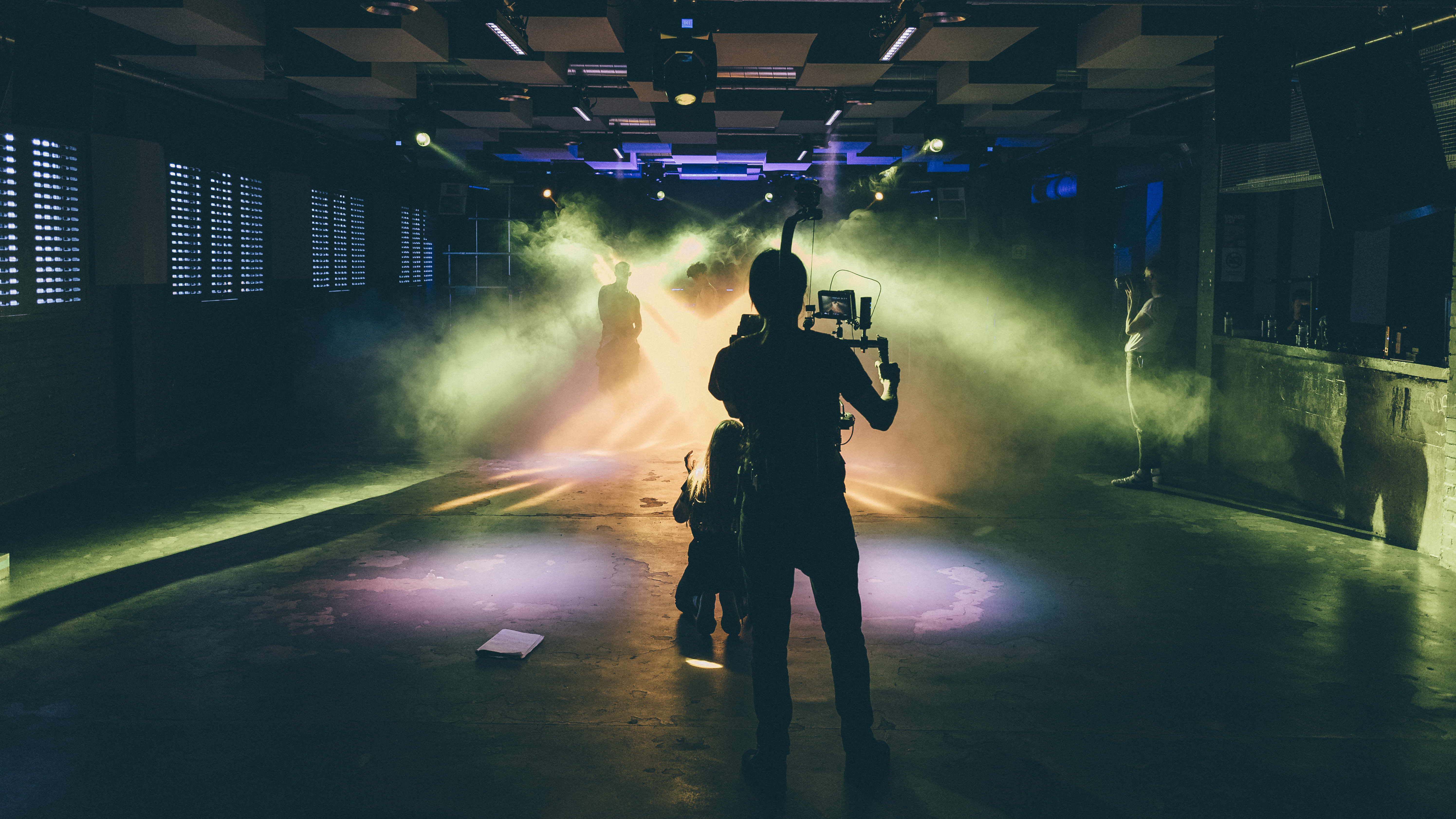 Dynamic event space in FOLD with dramatic lighting for creative gatherings. - Banner