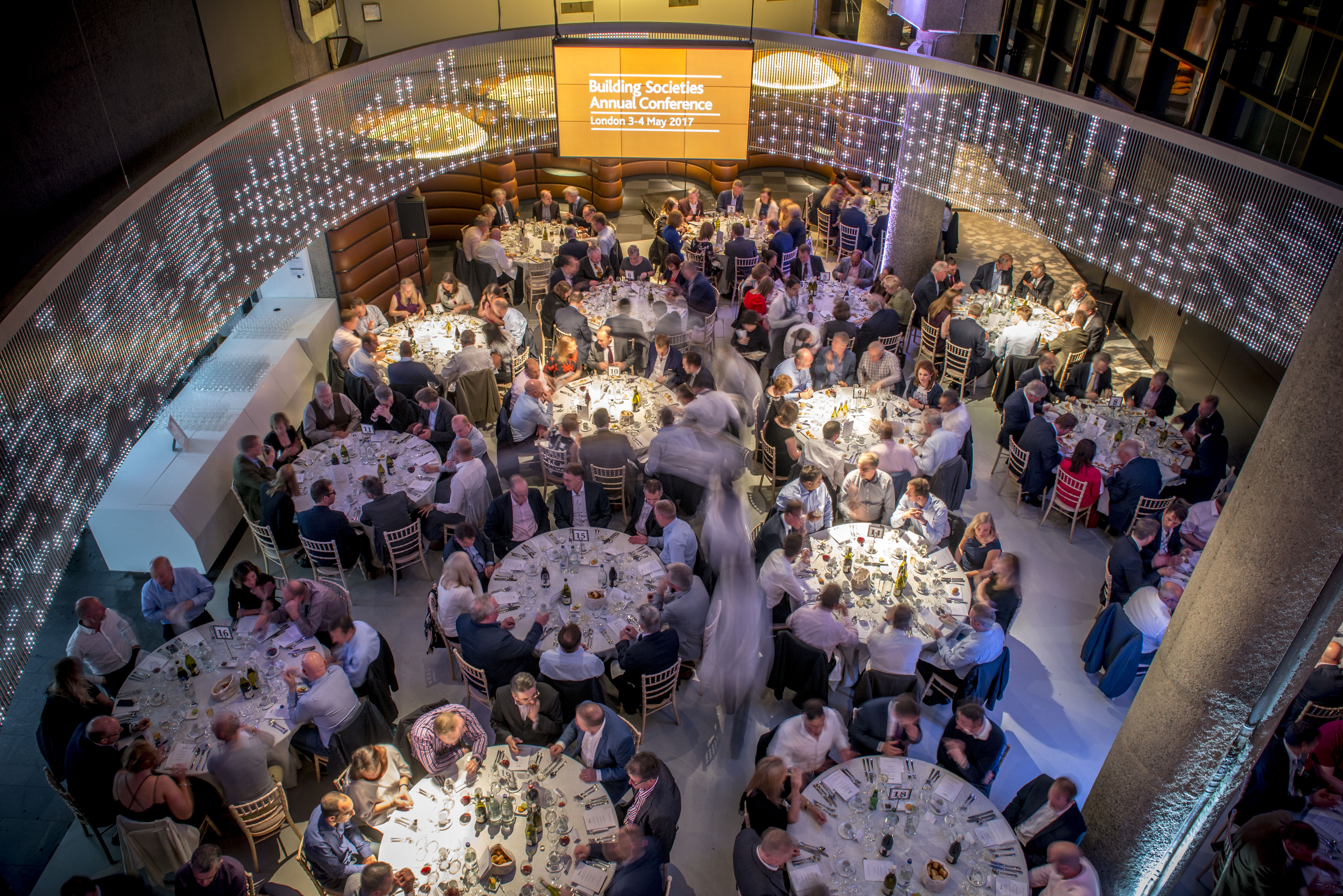 Gala dinner setup at London Ellipse Hall with elegant tables and ambient lighting. - Banner