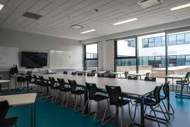 Modern breakout room with natural light for workshops at London Academy of Excellence.