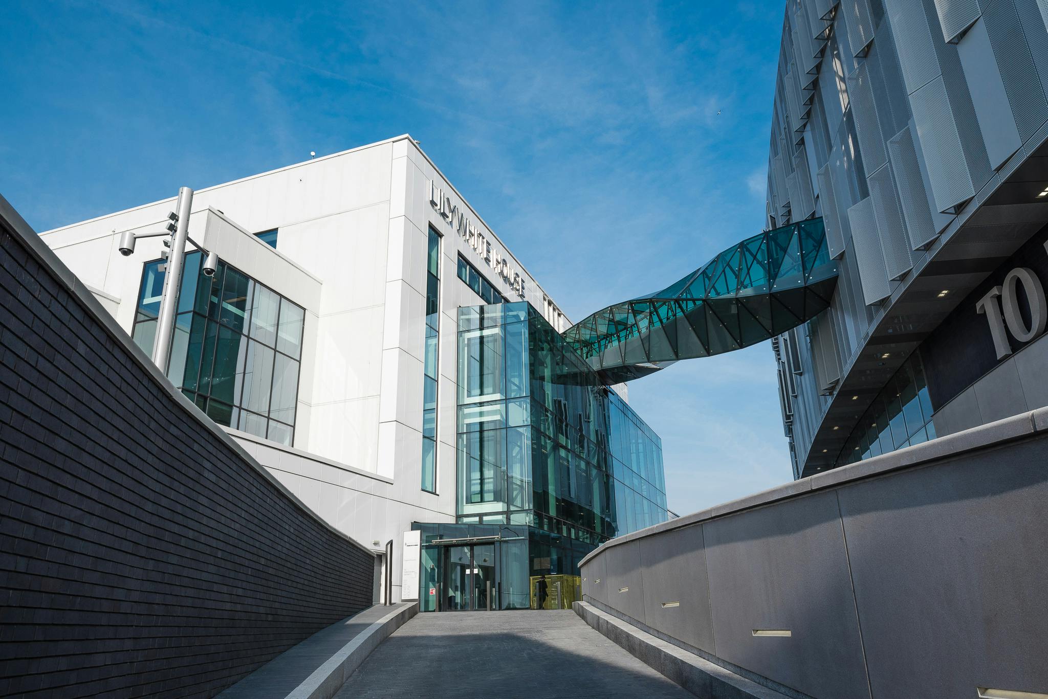 Modern dining space with glass bridge at London Academy of Excellence for events.