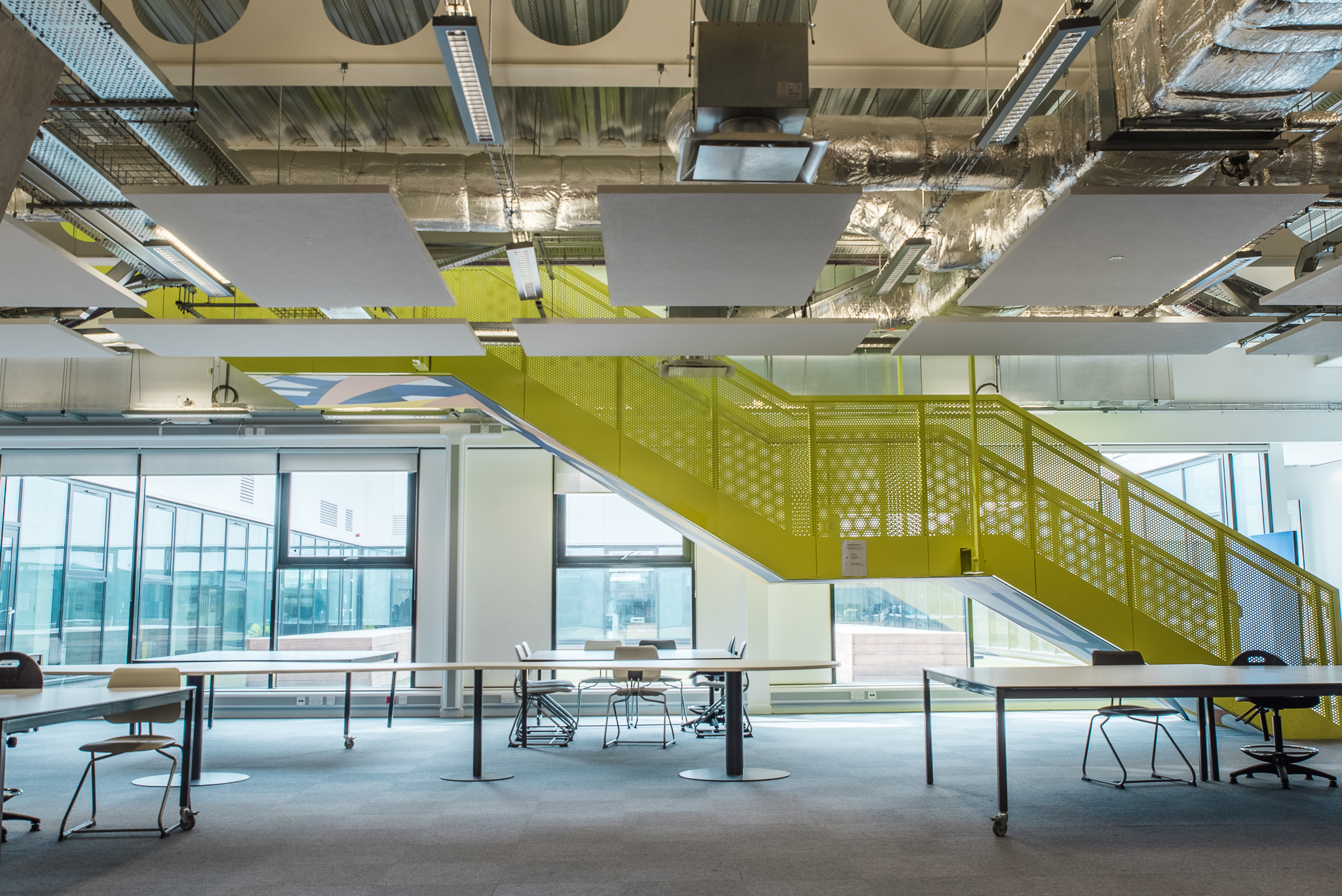 Modern dining space with flexible seating at London Academy of Excellence Tottenham. - Banner