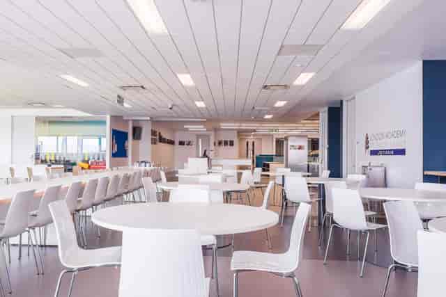 Modern dining space at London Academy of Excellence, ideal for workshops and networking.