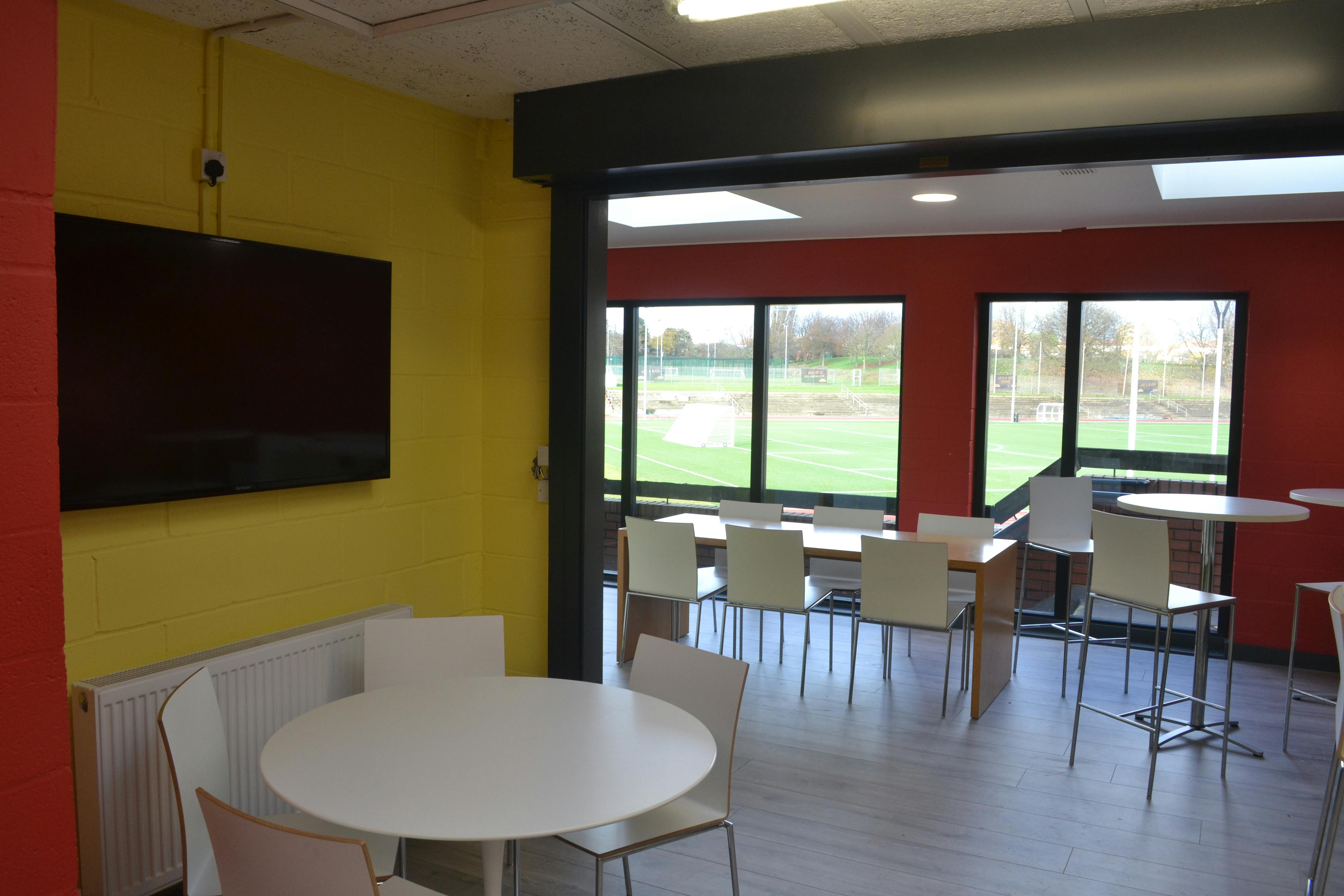 Modern Function Room & Bar in London, bright space for casual gatherings and networking.