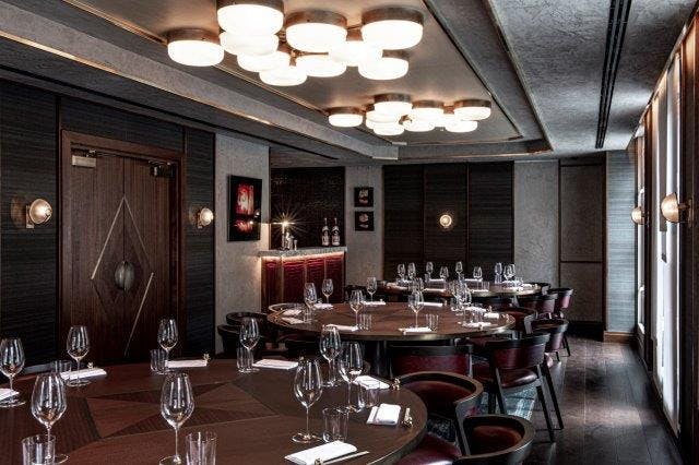 Elegant dining room in Lucky Cat by Gordon Ramsay, perfect for upscale events and meetings.