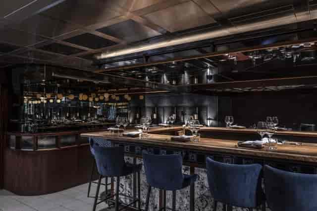 Sophisticated kitchen table in Lucky Cat by Gordon Ramsay for elegant dining events.