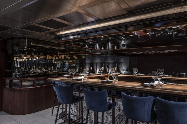 Sophisticated kitchen table in Lucky Cat by Gordon Ramsay for elegant dining events.