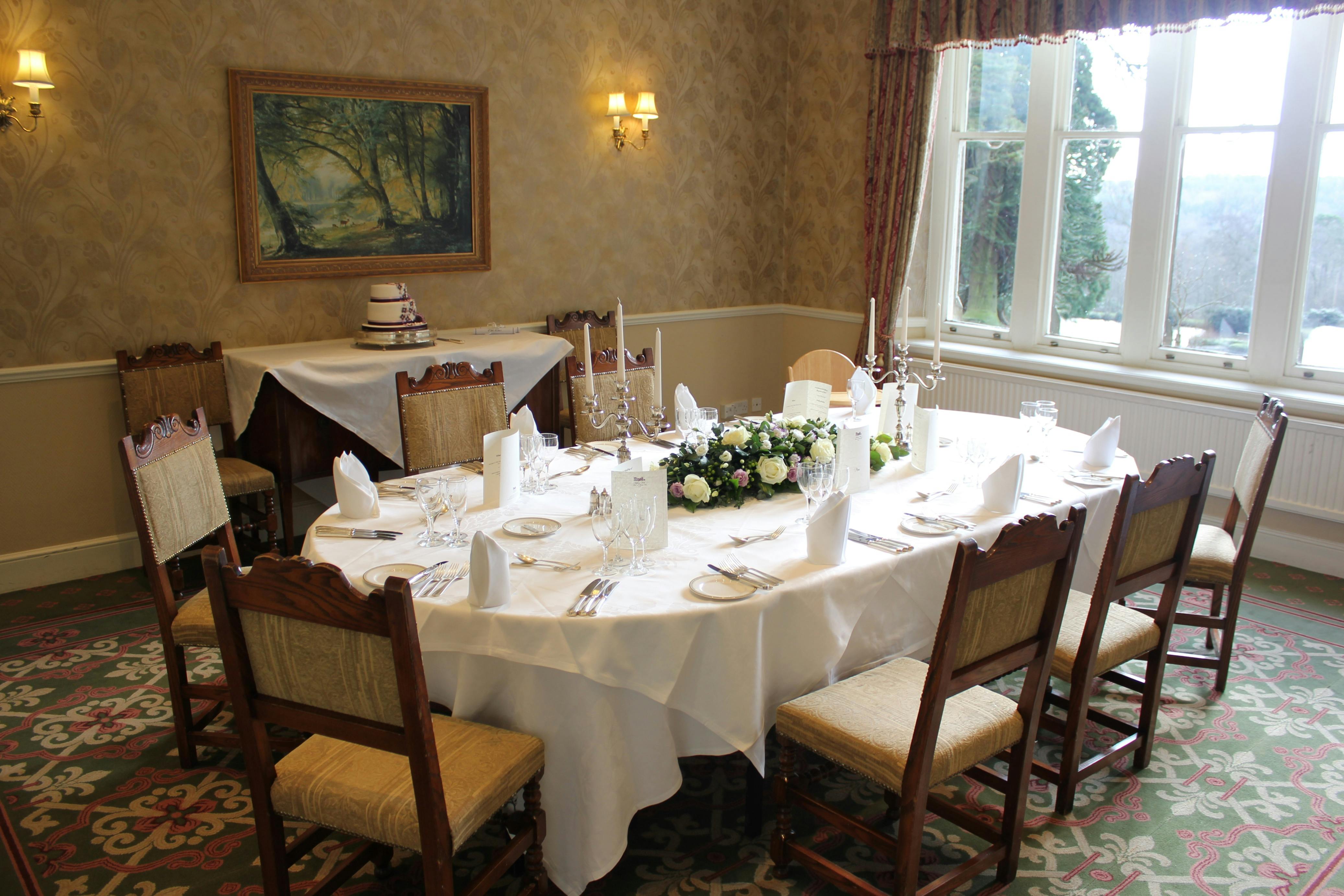 Elegant dining setup at Ashdown Park for corporate dinners and intimate gatherings.