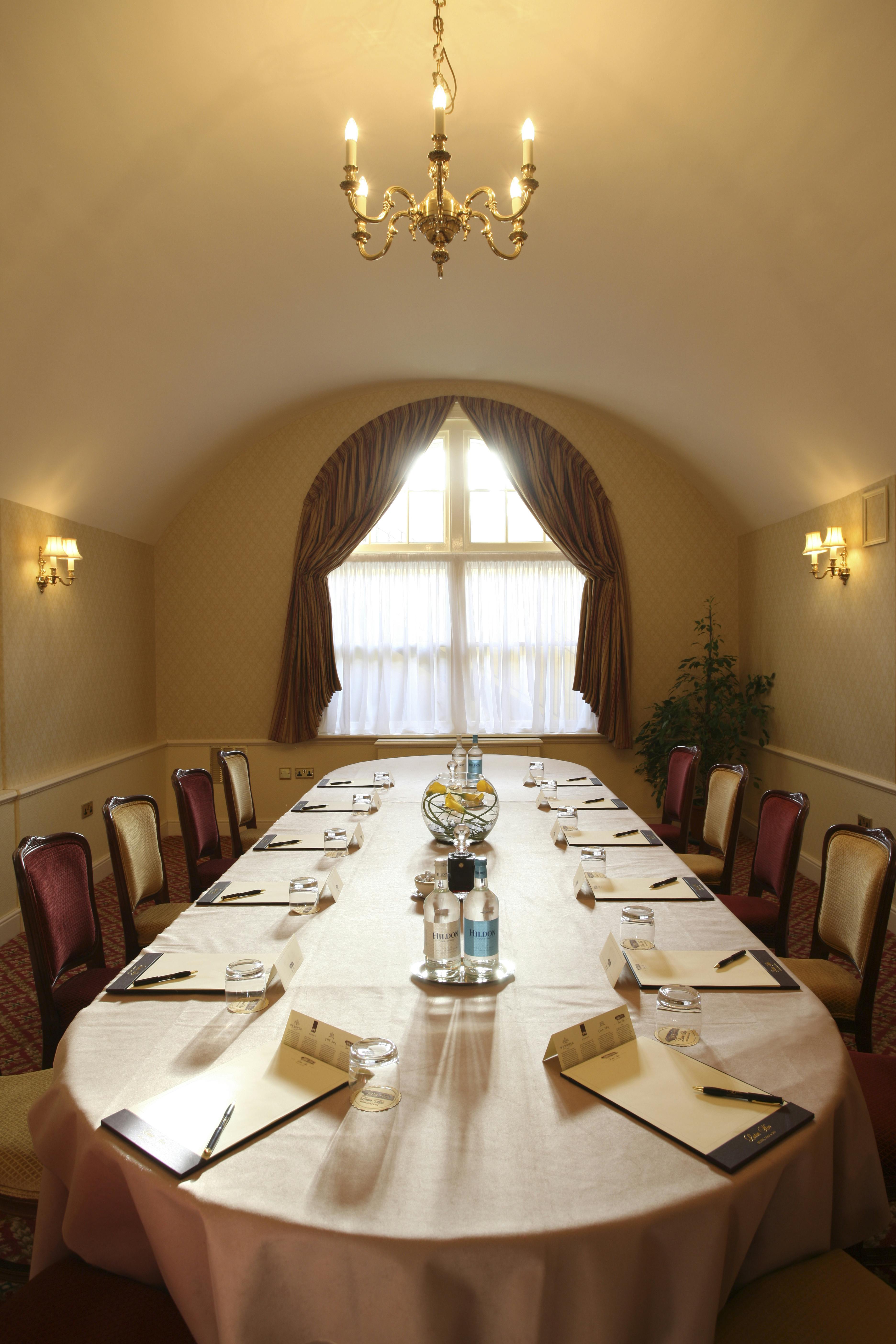 Charles Mewes in a bright, elegant meeting room at Luton Hoo Hotel for professional events.