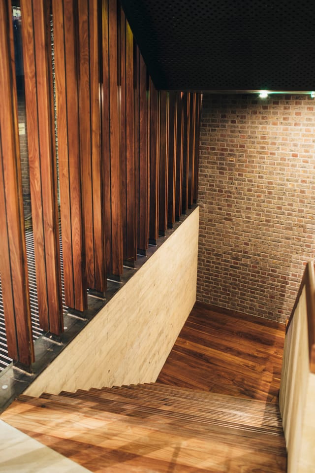 Modern Elizabeth Room with wood and brick, perfect for networking events and meetings.