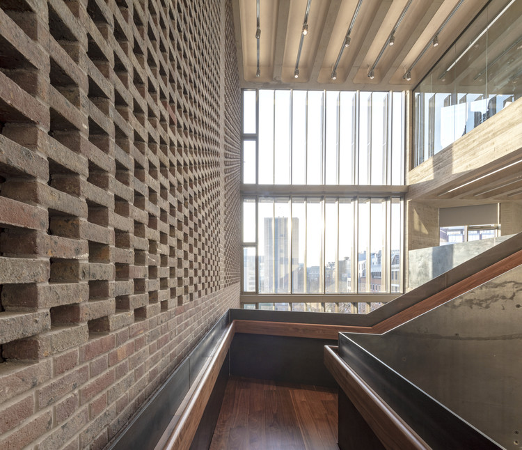Modern Elizabeth Room with brick and glass, perfect for networking events and meetings. - Banner