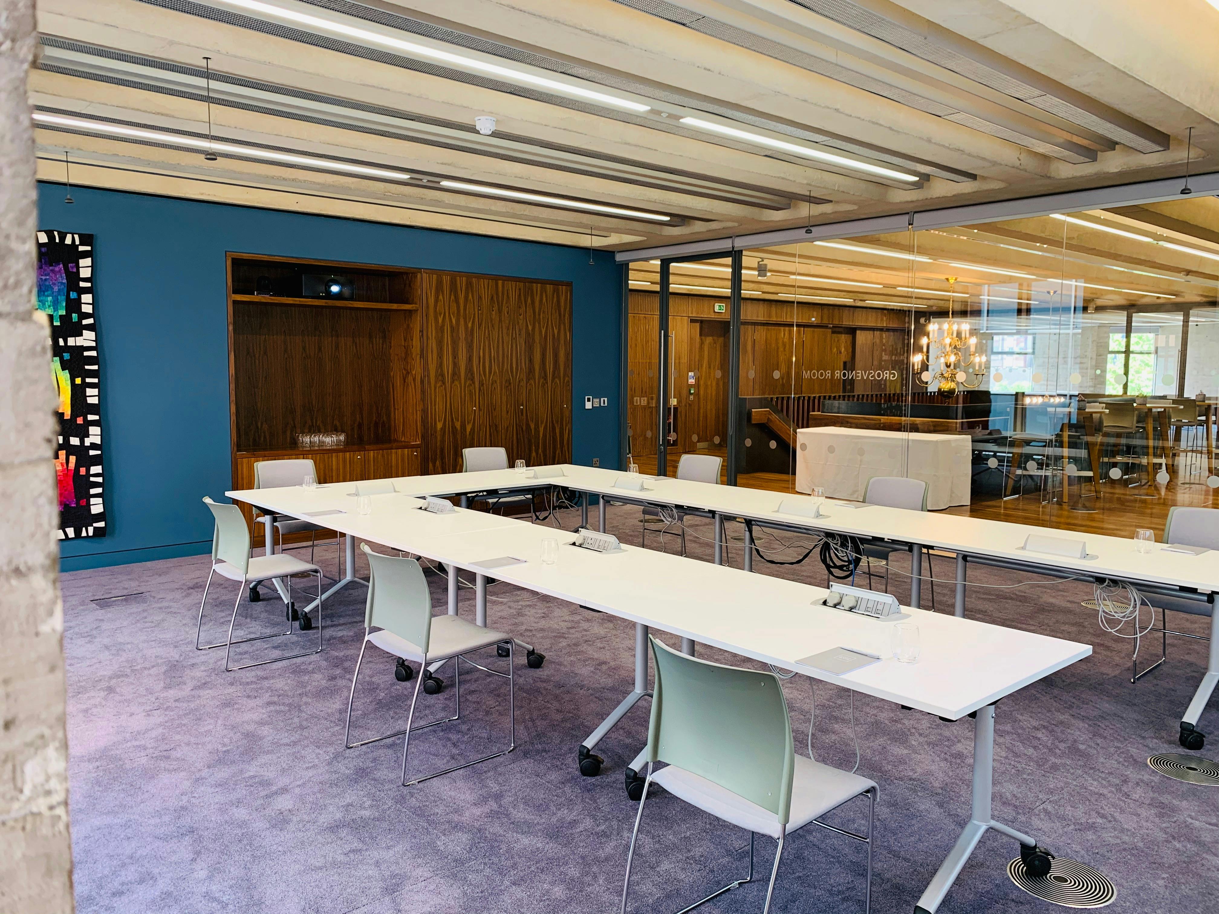 Modern Grosvenor Room with flexible table for meetings and presentations at Events @ No 6.