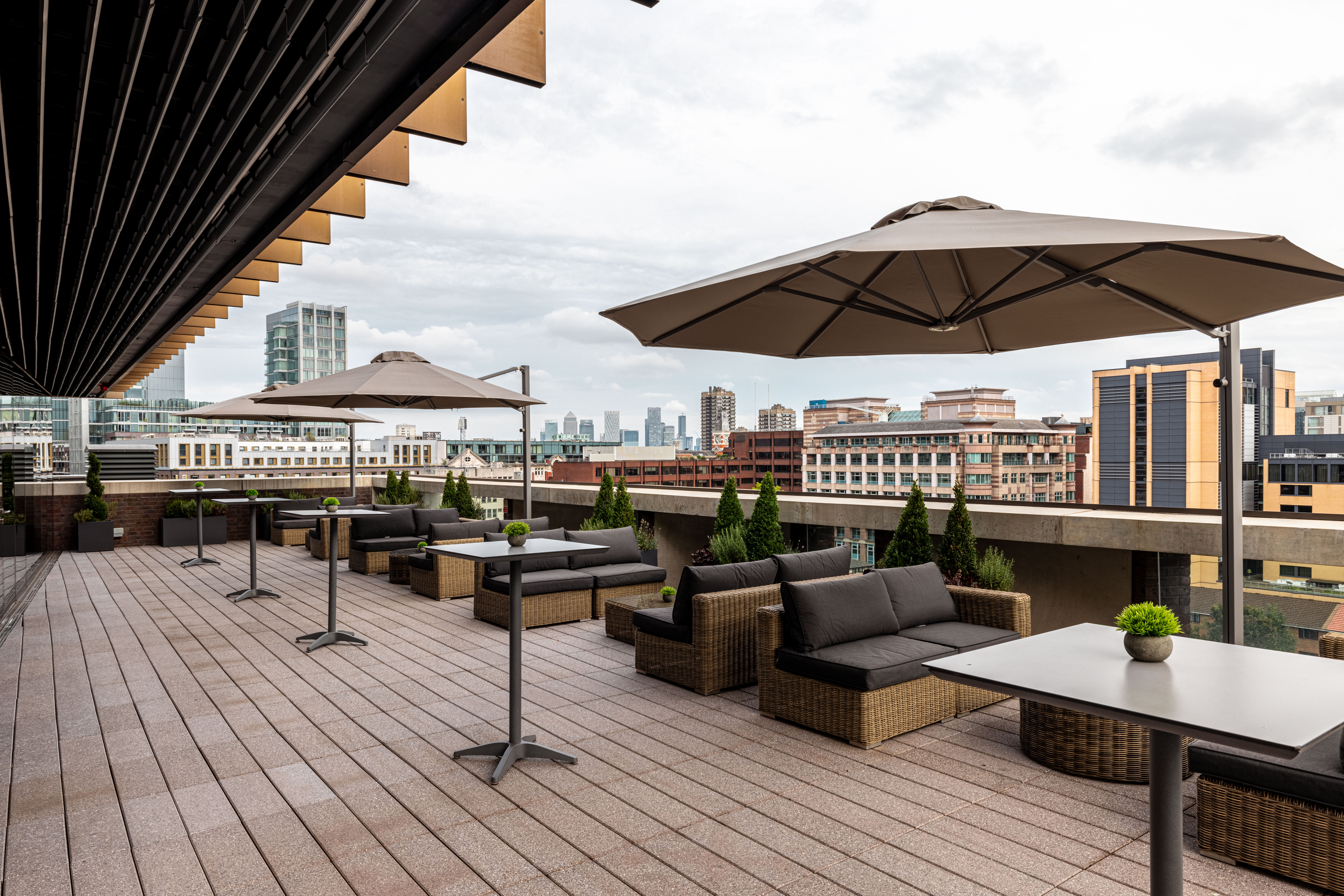Stylish rooftop venue with panoramic city view for networking events and gatherings. - Banner