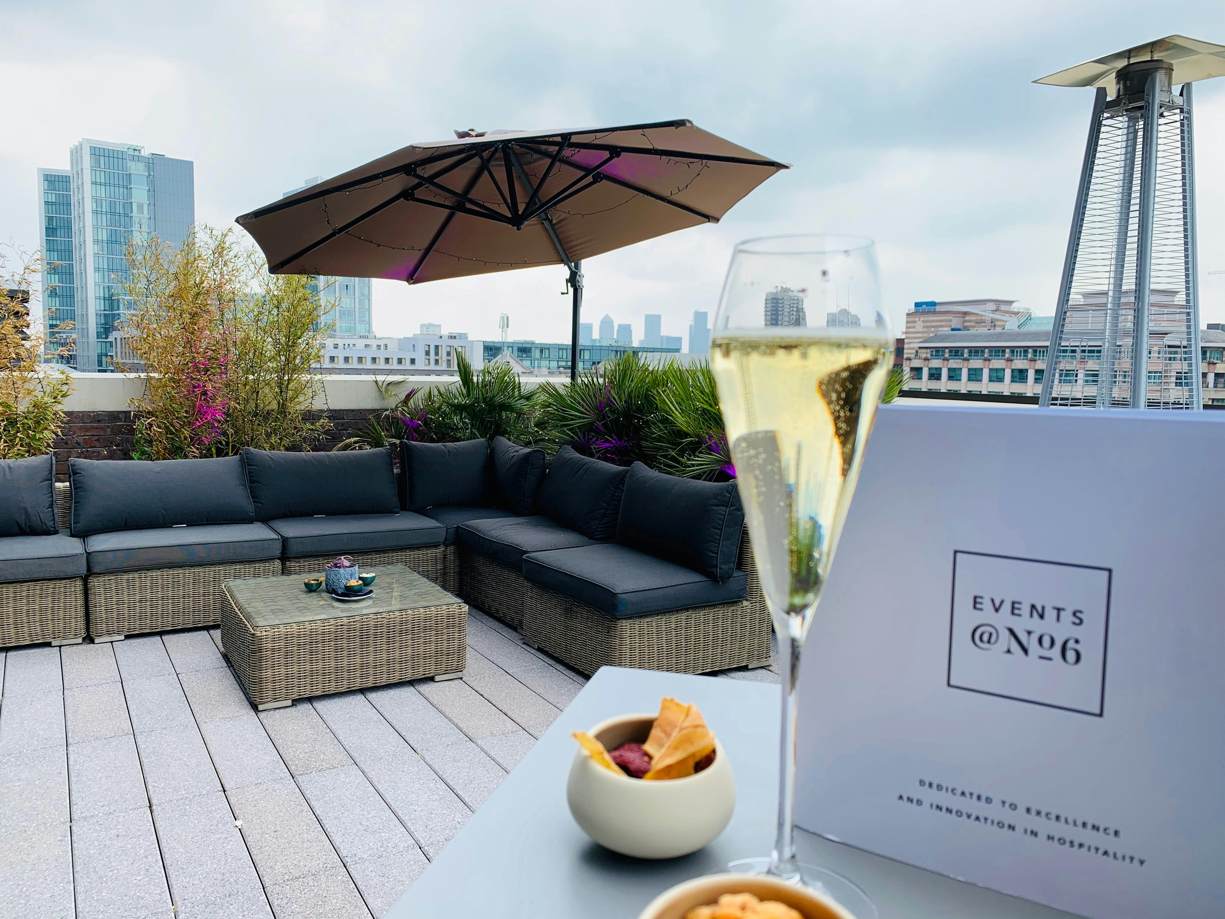 Stylish rooftop event space with elegant decor, perfect for upscale gatherings and networking.