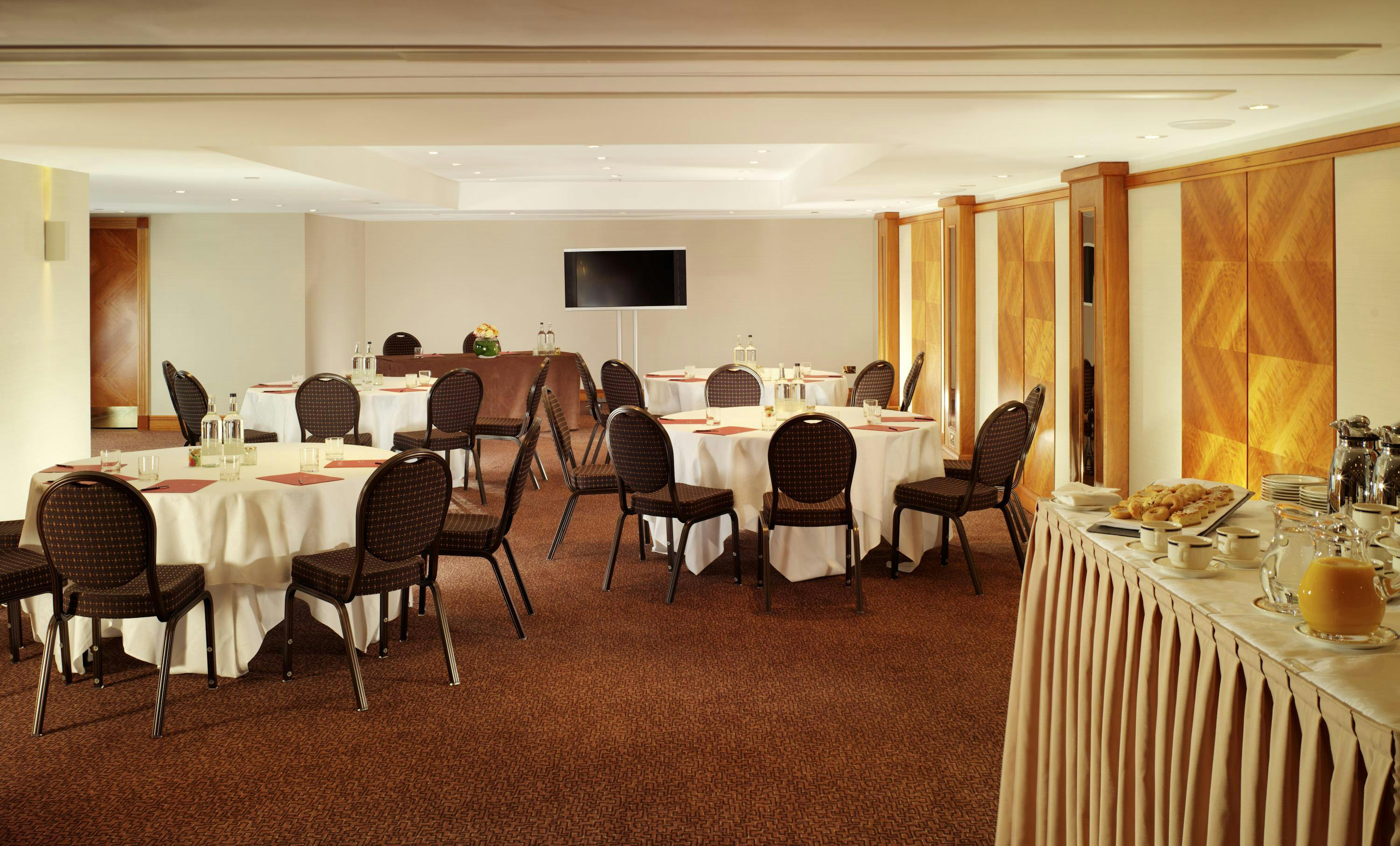 Elegant meeting room at Royal Garden Hotel, perfect for corporate events and gatherings.