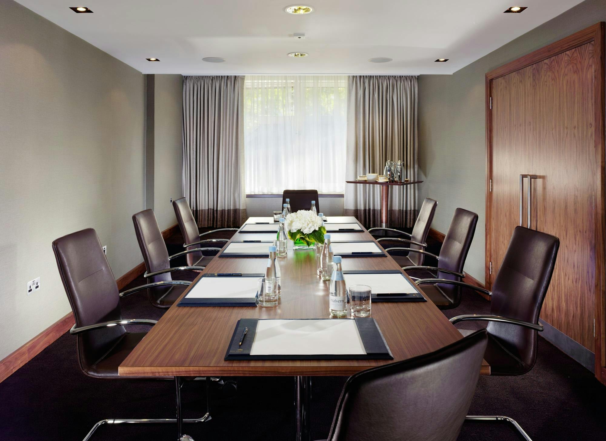 Highgrove Executive Boardroom with sleek wooden table, ideal for corporate meetings.