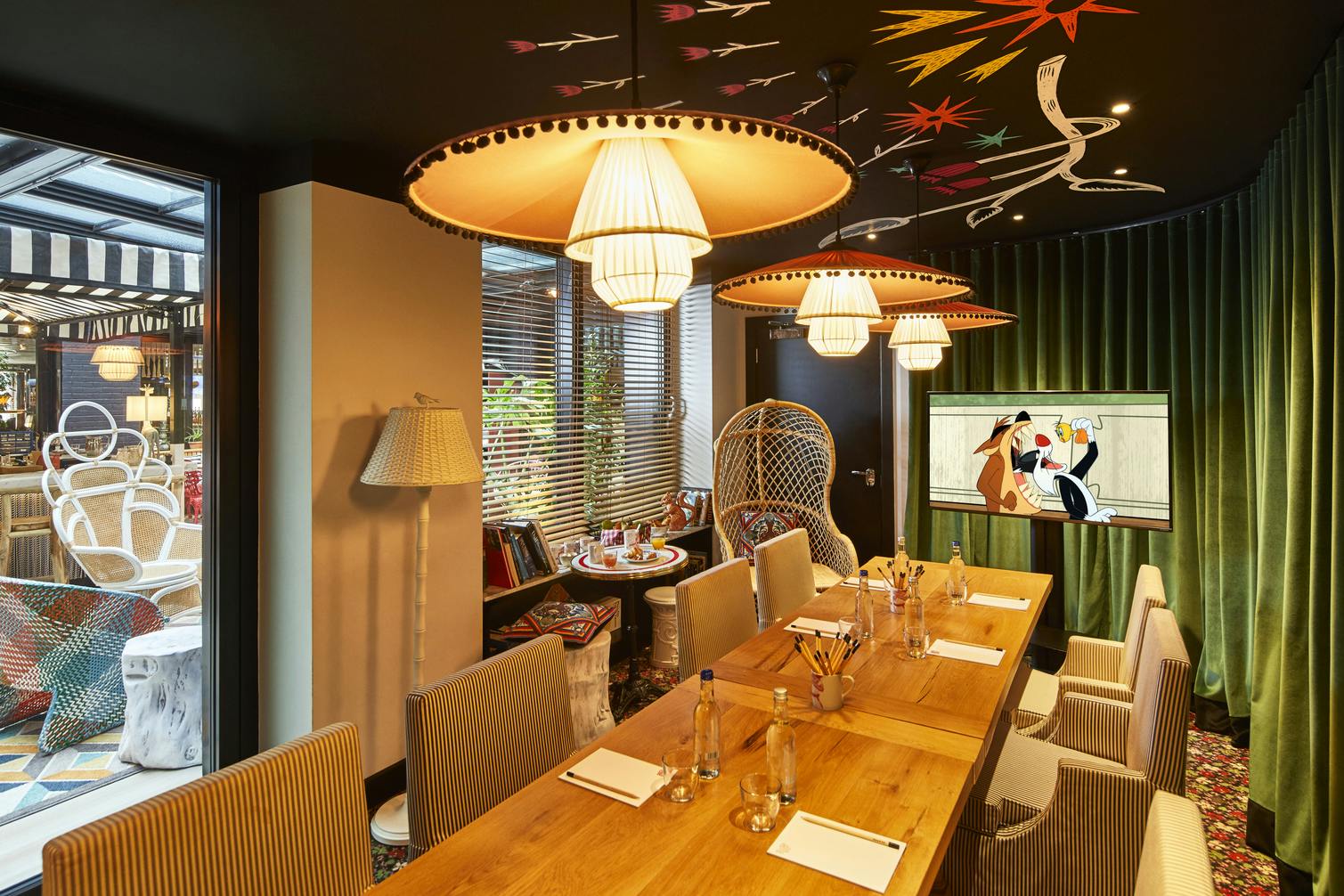 Private dining room at Mama Shelter London, featuring a long wooden table for meetings.