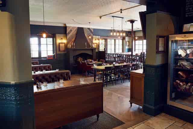 Versatile event space with fireplace for workshops and gatherings at The Royal Oak.