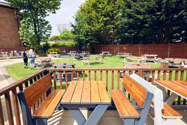 Outdoor event space with picnic tables for casual gatherings at The Royal Oak.